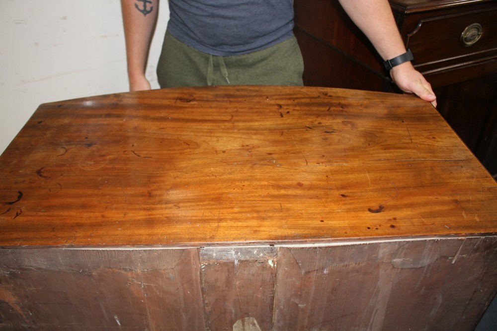 A Regency mahogany bowfront chest of two short and two graduated long drawers, on swept bracket feet, W.92cm D.50cm H.93cm